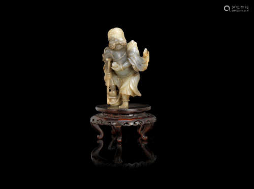18th/19th century A pale green and grey jade carving of Li Tieguai