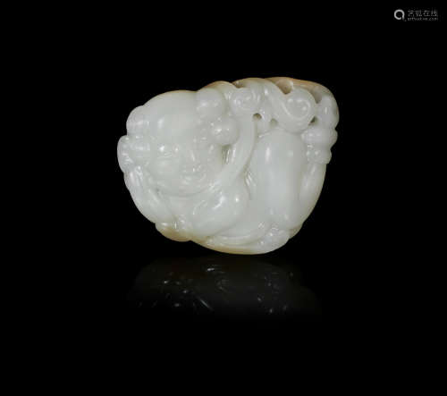 A white jade carving of an apsara