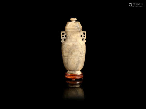 Mid-Qing Dynasty  A calcified jade archaistic vase and cover