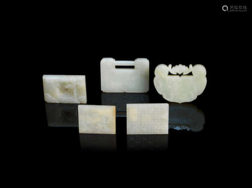 Qing Dynasty A group of five pale green and white jade plaques