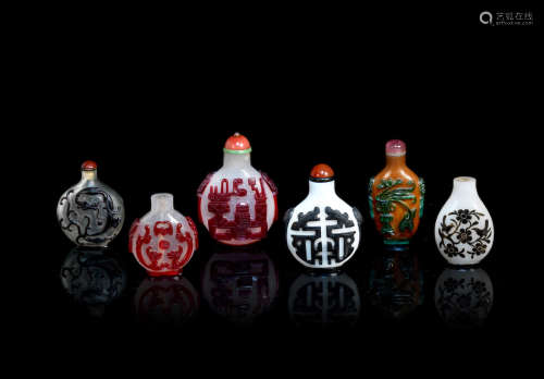 Qing Dynasty A group of six various red, black and green overlay glass snuff bottles
