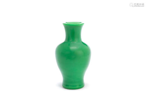 A green glass baluster vase