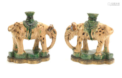 Ming Dynasty or later A pair of glazed 'elephant' incense stick holders
