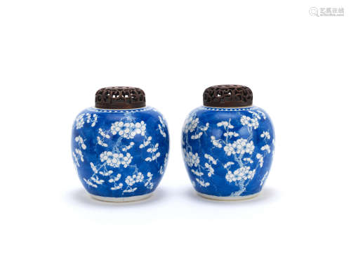 Kangxi A pair of blue and white beaker vases and a pair of prunus jars