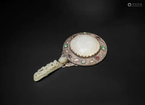 19th century A jade and white metal mounted mirror