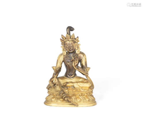 Mongolia or Tibet, 18th/19th century  A parcel-gilt copper alloy figure of Tara