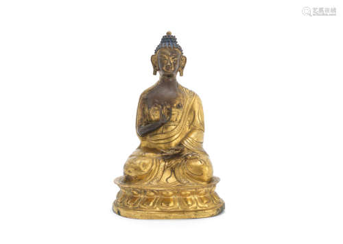 19th century A gilt copper alloy repoussé figure of Buddha Shakyamuni