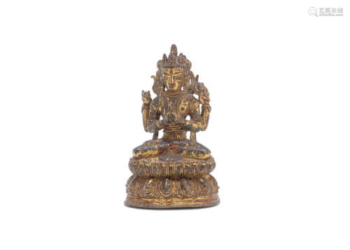 Nepal or Tibet, circa 15th century A gilt-lacquered copper alloy figure of Avalokiteshvara Shadakshari