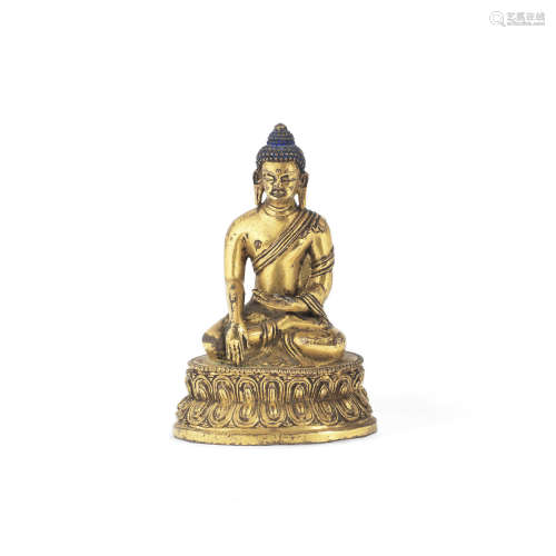 Tibet, 16th/17th century  A gilt copper alloy figure of Shakyamuni