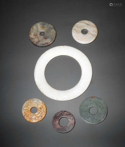 Zhou/Han Dynasty and later A group of six jade rings and discs, huan and bi