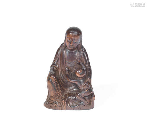 Late Ming Dynasty A fine wood 'Guanyin and child' carving