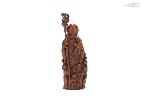 18th/19th century An unusual bamboo standing figure of Shoulao and five children