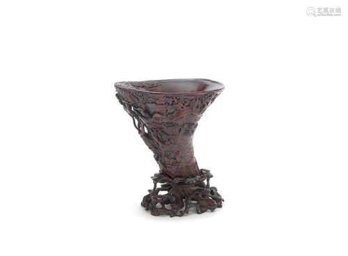 19th century A carved wood libation cup and stand