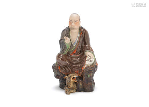 Attributed to Zeng Longsheng, 20th century An enamelled and biscuit figure of an arhat