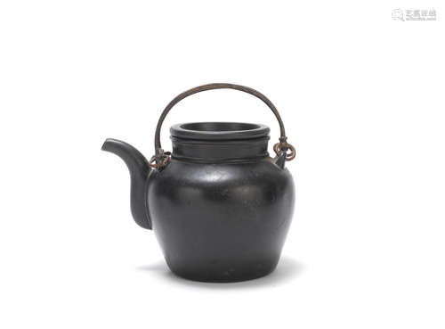 Early 20th century, probably Yufeng Workshop A brown/black clay Yixing teapot and cover