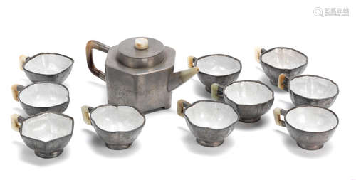 19th century A pewter-encased Yixing teapot and a set of ten cups