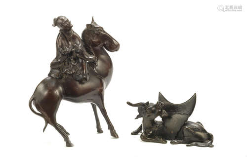 Ming Dynasty and later A bronze 'mythical beast' mirror stand and a bronze equestrian group