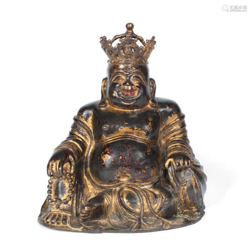 Ming Dynasty A gilt lacquered bronze figure of Budai