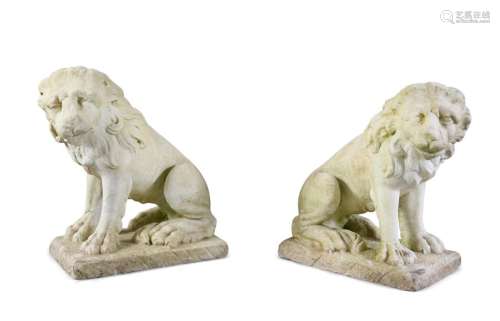 A PAIR OF CARVED MARBLE LIONS, seated, on rectangu…
