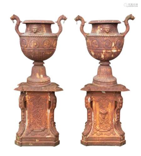 A PAIR OF MONUMENTAL FRENCH CAST IRON URNS AND PED…