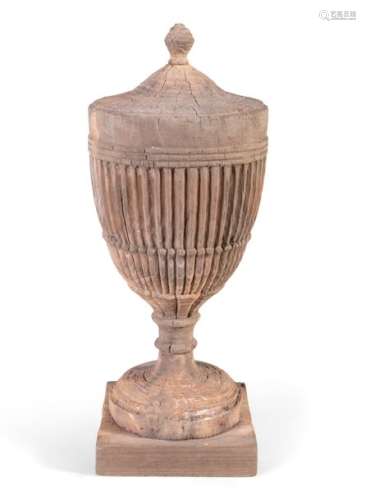 A GEORGIAN CARVED STRIPPED PINE NEO CLASSICAL URN,…