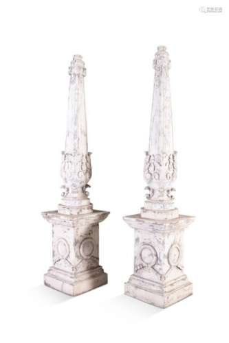 A PAIR OF PAINTED AND CARVED TIMBER OBELISKS, the …