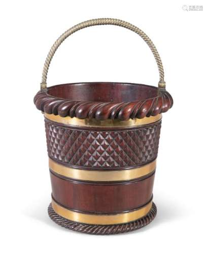 A MAHOGANY AND BRASS BOUND BUCKET, c.1830, with ro…