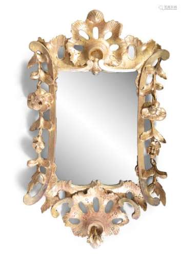 A GEORGE III CARVED GILTWOOD WALL MIRROR, the shap…