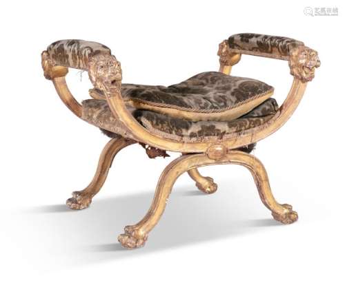 A REGENCY CARVED GILTWOOD STOOL, in the manner of …