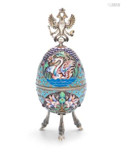 A RUSSIAN SILVER GILT & CLOISONNE EGG, struck with…