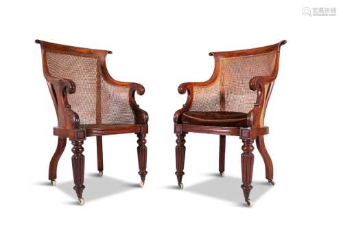 A PAIR OF GEORGE IV LIBRARY ARMCHAIRS, with cane s…