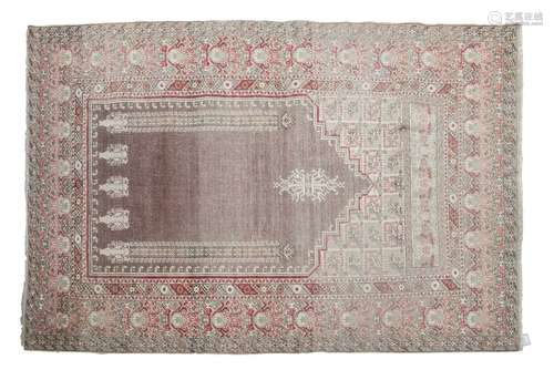 A 19TH CENTURY SILK PRAYER RUG, the central field …