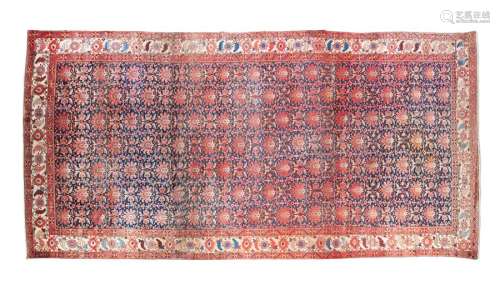 AN ANTIQUE NORTH WEST PERSIAN WOOL CARPET, of oval…