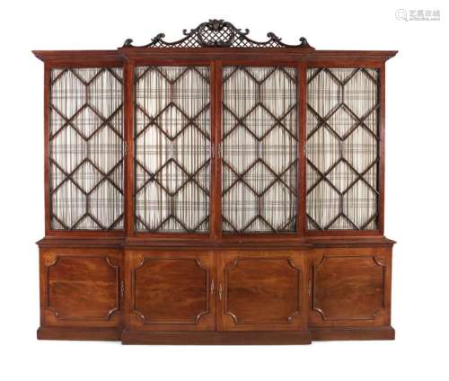 A GEORGE III MAHOGANY BREAKFRONT BOOKCASE, the mou…