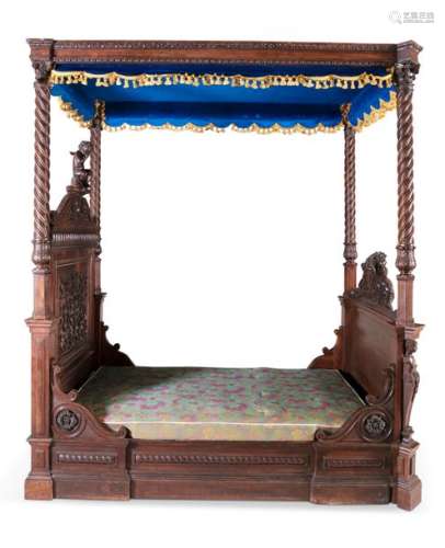 A 19TH CENTURY CARVED OAK FOUR POSTER BED, the cap…
