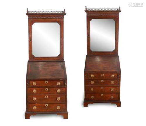 A PAIR OF GEORGE III MAHOGANY COMPACT BUREAU BOOKC…