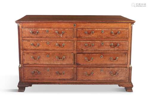 A GEORGE II OAK LONG RECTANGULAR CHEST, with lift …