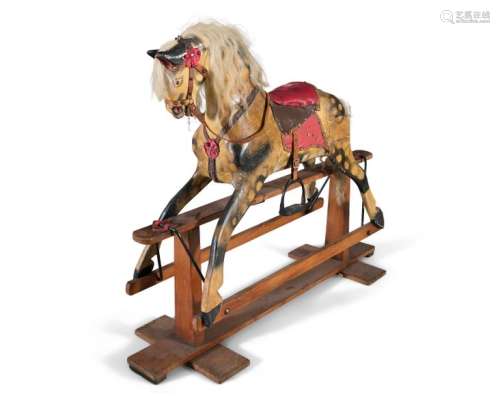 A 19TH CENTURY PAINTED PINE ROCKING HORSE, the yel…