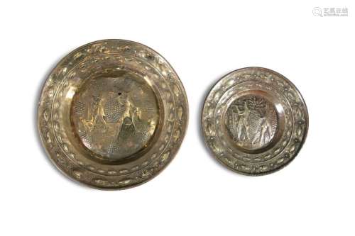 TWO 17TH CENTURY GERMAN BRASS ALMS DISHES, each of…