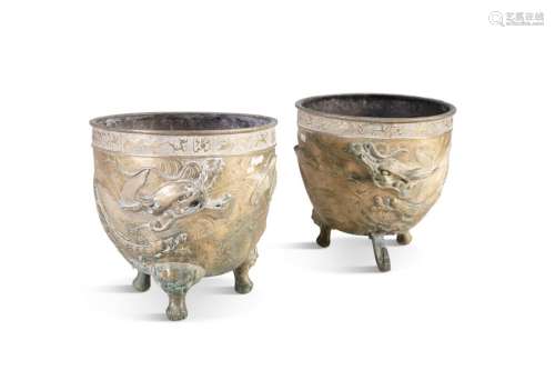 A PAIR OF CHINESE CAST BRONZE CIRCULAR URNS, decor…