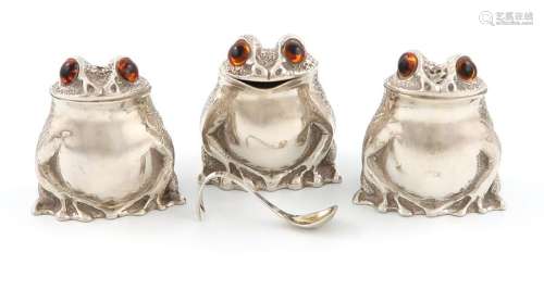 A three piece modern silver frog cruet set, by Ric…