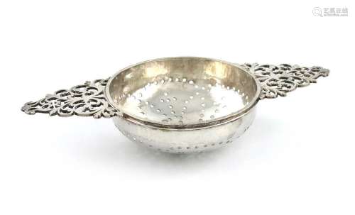 A George I silver two handled lemon strainer, by J…
