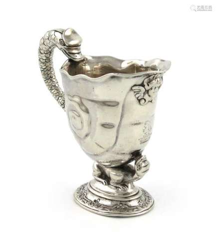 An early 18th century cast silver cream jug, unmar…