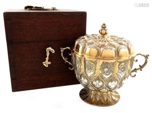 An Edwardian silver gilt two handled replica cup a…