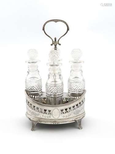 A George III silver four bottle sauce cruet frame,…