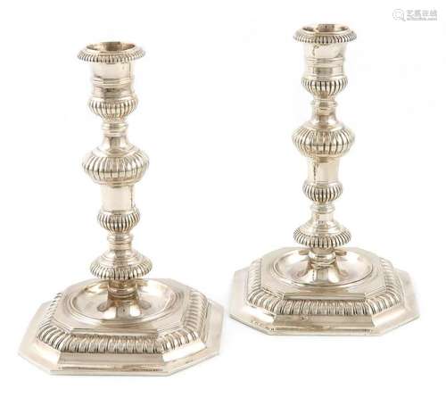 A pair of modern cast silver candlesticks, by D an…