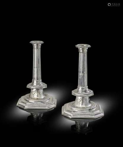 A pair of Queen Anne silver candlesticks, by John …