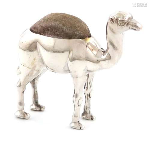 An Edwardian novelty silver camel pin cushion, by …