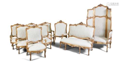 AN ITALIAN CARVED GILTWOOD SALON SUITE, comprising…