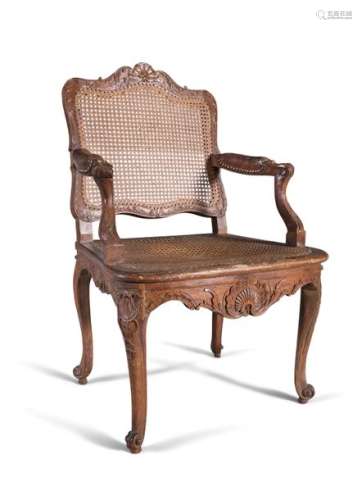 AN IRISH GEORGE IV BERGERE MAHOGANY FRAMED ARMCHAI…